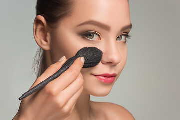 Image showing Beautiful female eyes with make-up and brush