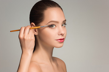 Image showing Beautiful female eyes with make-up and brush