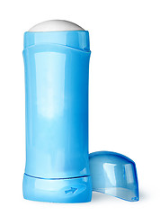 Image showing Blue deodorant container cap behind