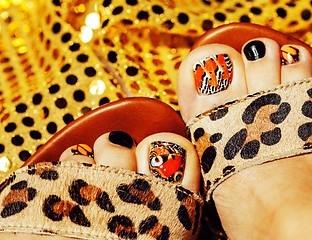 Image showing photo of pedicure like butterfly design on gold background close