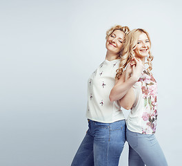 Image showing mother with daughter together posing happy smiling isolated on white background with copyspace, lifestyle people concept closeup