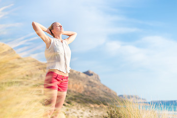 Image showing Free Happy Woman Enjoying Sun on Vacations.