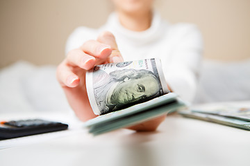 Image showing Hands counting money, close up