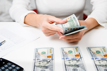 Image showing Hands counting money, close up