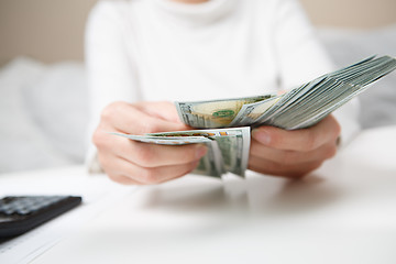 Image showing Hands counting money, close up