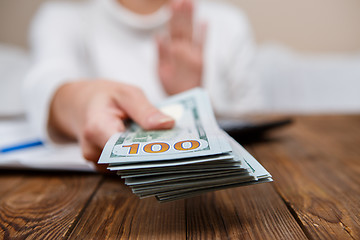 Image showing Hands of person proposing money to you - closeup shot