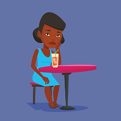 Image showing Woman drinking cocktail at the bar.