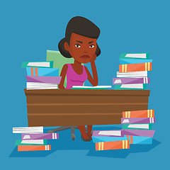 Image showing Student sitting at the table with piles of books.