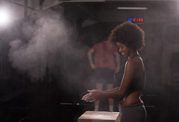 Image showing black woman preparing for climbing workout