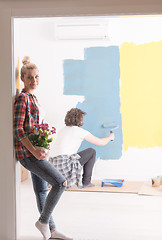 Image showing happy young couple doing home renovations