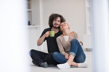 Image showing young couple in their new home