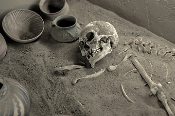 Image showing Aged skeleton with pots