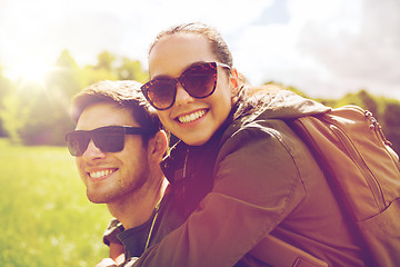 Image showing happy couple with backpacks having fun outdoors