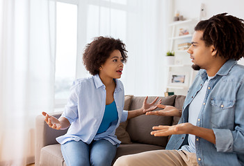 Image showing unhappy couple having argument at home