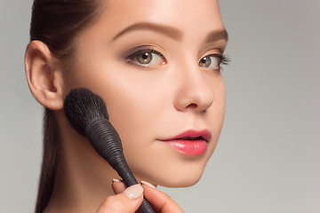 Image showing Beautiful female eyes with make-up and brush