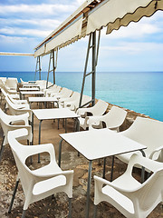 Image showing White tables in a cafe by the seaside