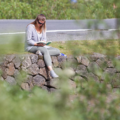 Image showing Women sitting near riverside