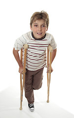 Image showing Injured child using crutches