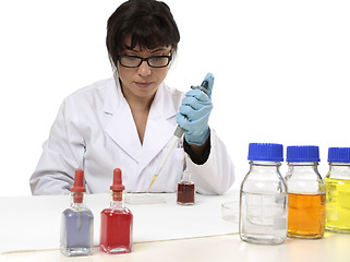 Image showing Scientist using pipette and spotting plate