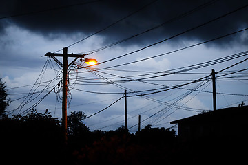 Image showing Street light at night with a stormy sky background