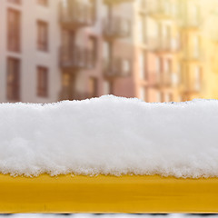 Image showing snow on the bench