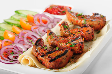 Image showing Grilled lamb tongues with fresh vegetables salad