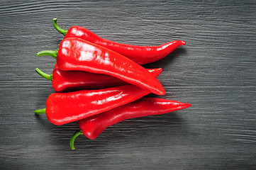 Image showing Sweet red Kapia peppers on a dark shale stone background