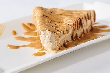 Image showing Delicious cheesecake with caramel topping