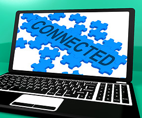 Image showing Connected Puzzle On Notebook Showing Online Communities