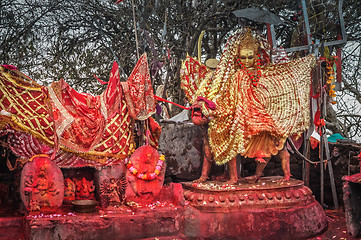 Image showing Golden and red statue