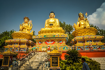 Image showing Three golden statues