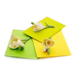 Image showing Close up of three yellow envelope with flowers