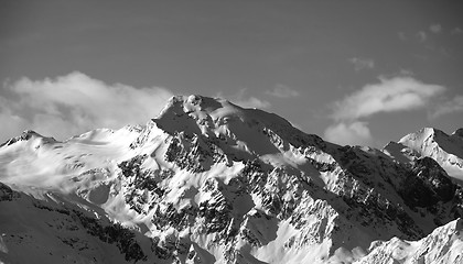 Image showing Black and white view on snowy mountains at sun day