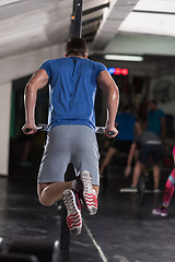 Image showing man doing exercises parallel bars