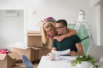 Image showing Young couple moving in a new home