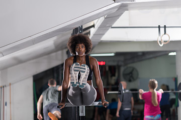 Image showing black woman doing parallel bars Exercise