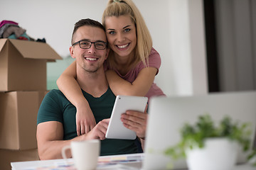 Image showing Young couple moving in a new home