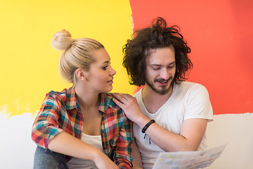 Image showing Happy young couple relaxing after painting