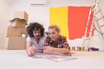 Image showing Happy young couple relaxing after painting