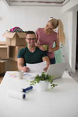 Image showing Young couple moving in a new home