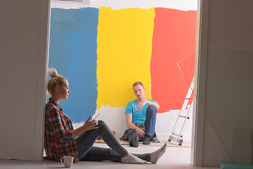 Image showing Happy young couple relaxing after painting