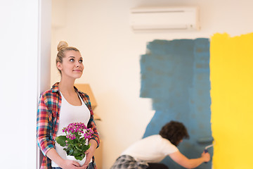 Image showing happy young couple doing home renovations