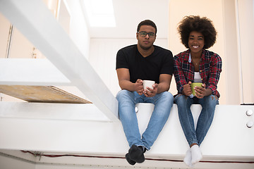 Image showing couple having break during moving to new house