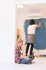 Image showing Happy couple doing home renovations