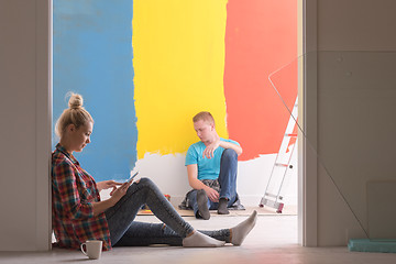 Image showing Happy young couple relaxing after painting