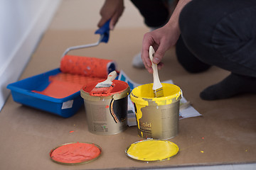 Image showing painters prepare color for painting