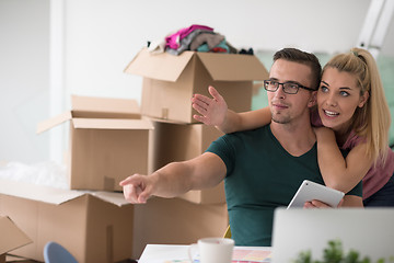 Image showing Young couple moving in a new home