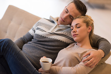 Image showing Young couple  in front of fireplace