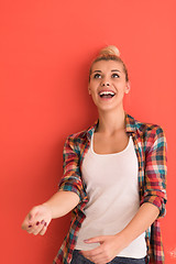 Image showing woman over color background plays with apple