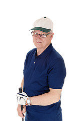 Image showing Senior man standing with golf hat.